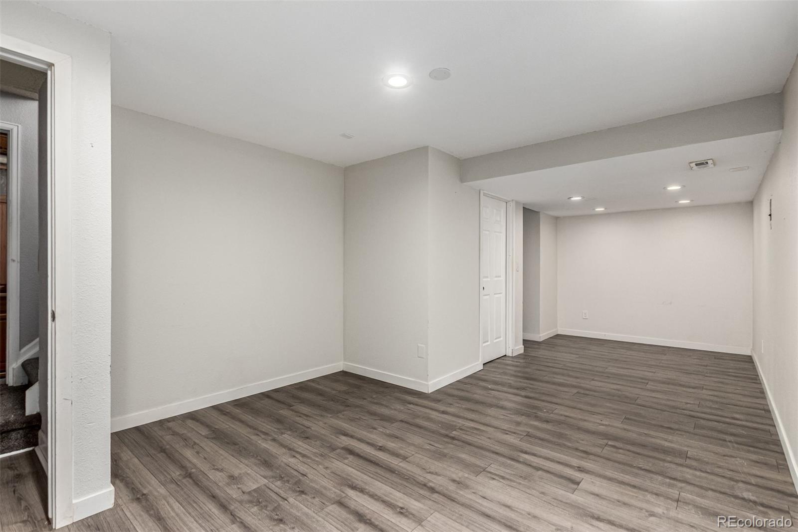3623 West Rosewalk Circle Highlands Ranch, CO 80129 - Photo 35 of 44 a view of an empty room with wooden floor