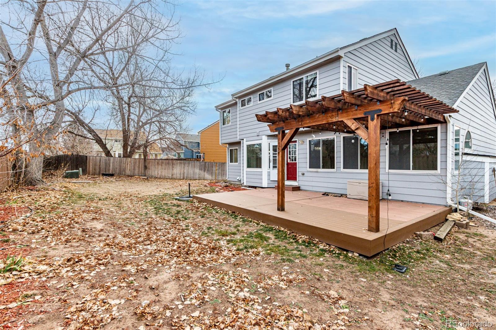 3623 West Rosewalk Circle Highlands Ranch, CO 80129 - Photo 43 of 44 a front view of a house with garden