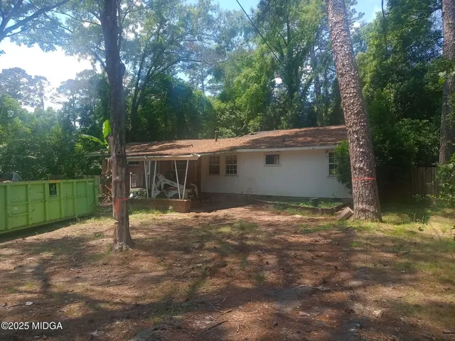 a backyard of a house with lots of green space
