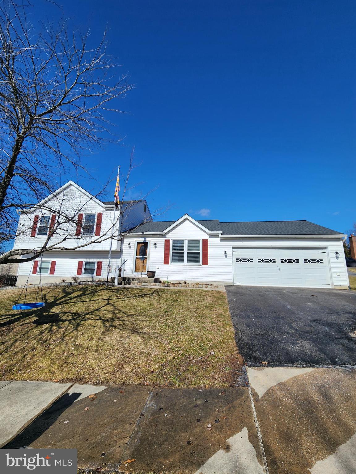 6660 Hunter Road Elkridge, MD 21075 - Photo 1 of 27 a view of a white house with a yard