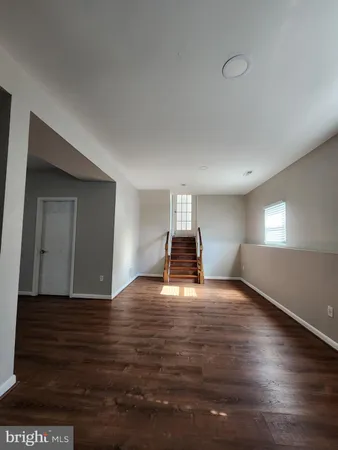 a view of a livingroom with wooden floor