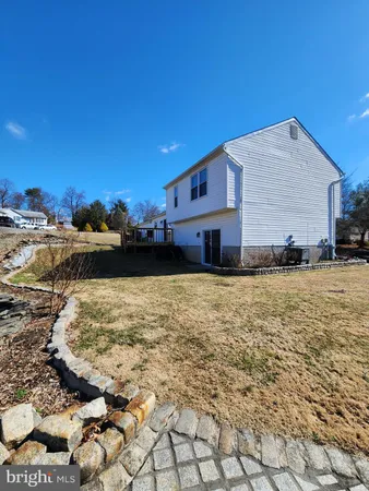 a view of a yard and front view of a house