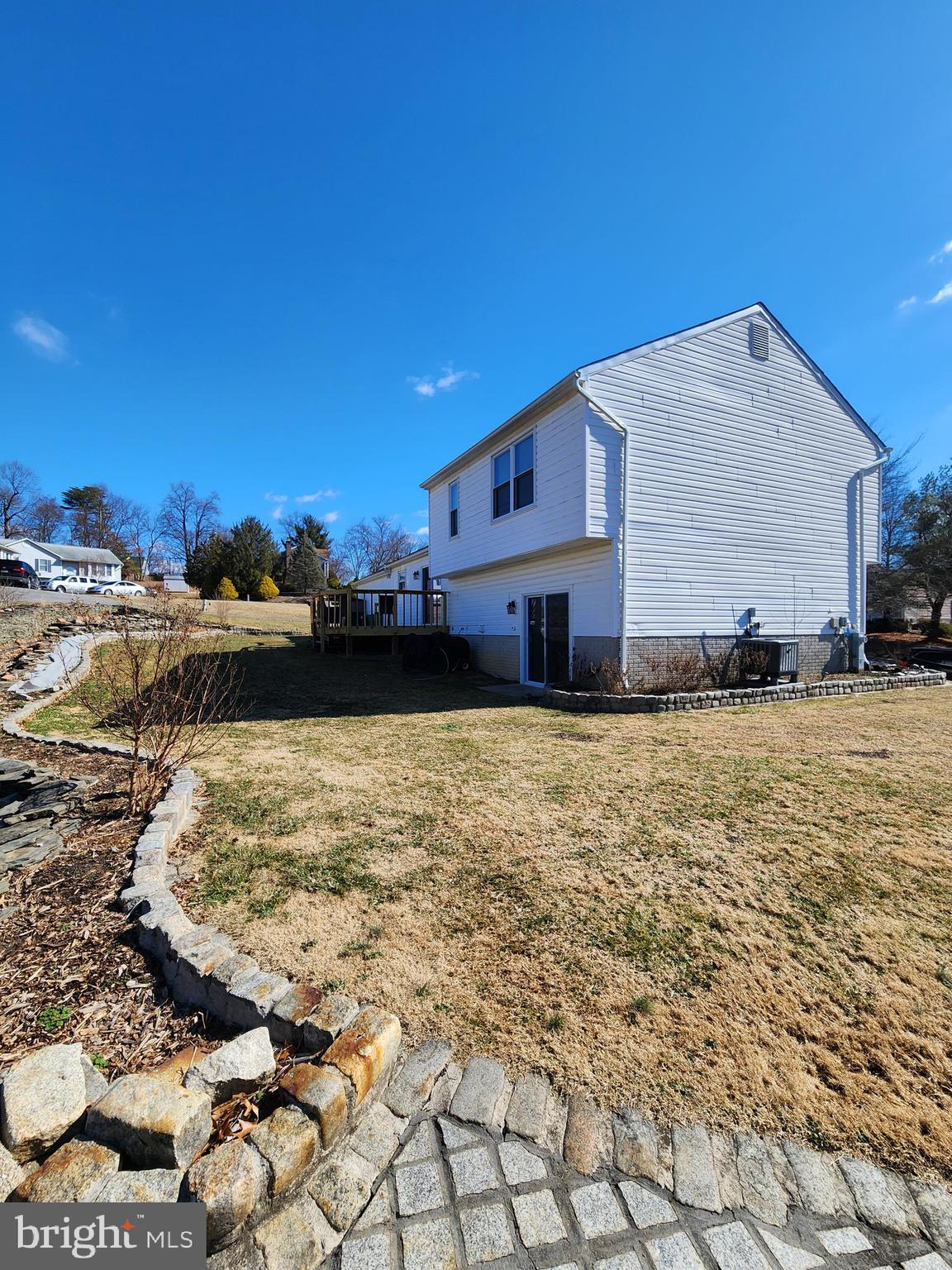 6660 Hunter Road Elkridge, MD 21075 - Photo 25 of 27 a view of a yard and front view of a house