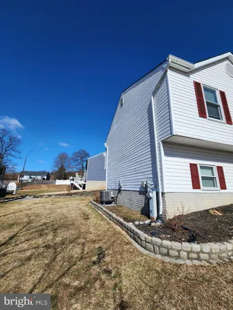 a view of a house with snow on the road