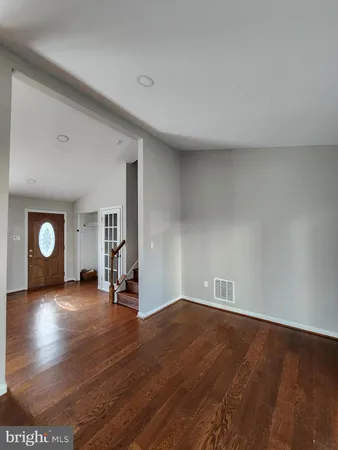 a view of a livingroom with wooden floor
