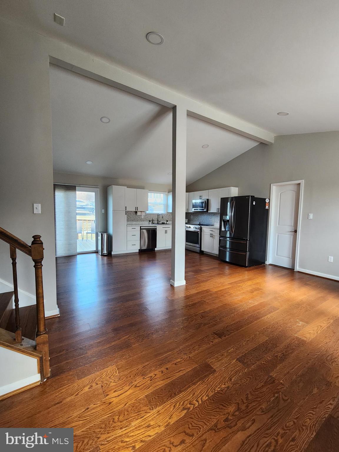 6660 Hunter Road Elkridge, MD 21075 - Photo 5 of 27 a view of empty room with wooden floor and windows