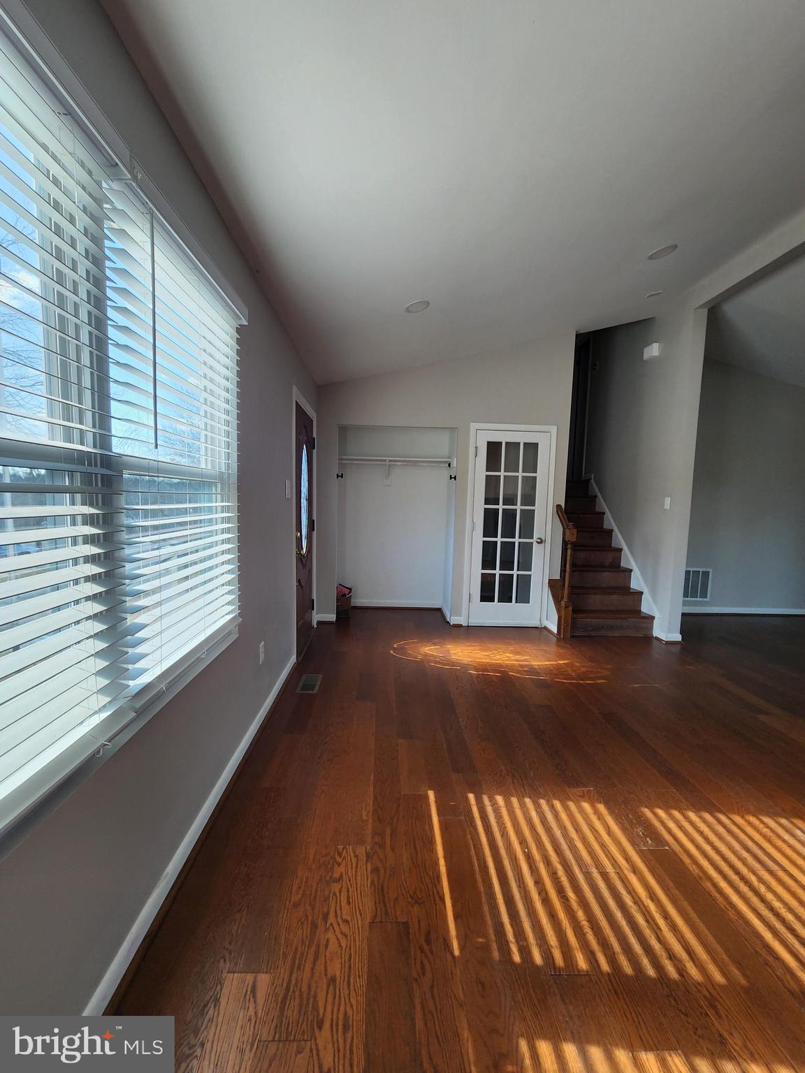 6660 Hunter Road Elkridge, MD 21075 - Photo 7 of 27 a view of empty room with wooden floor and fan
