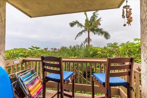 a view of a chairs and table in patio