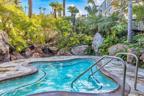 an aerial view of a house with a yard and large trees