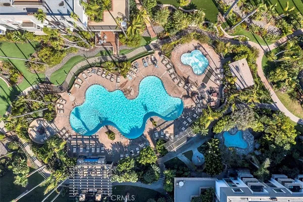 a swimming pool with outdoor seating