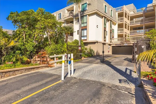 a sign that is sitting in front of flowers