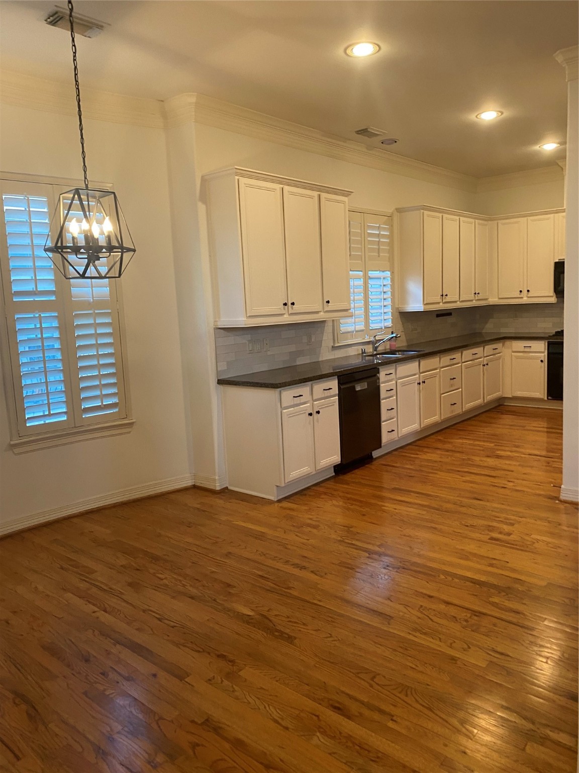 1421 Bremond Street Houston, TX 77004 - Photo 22 of 30 a large kitchen with stainless steel appliances granite countertop a dishwasher a stove and a wooden floors