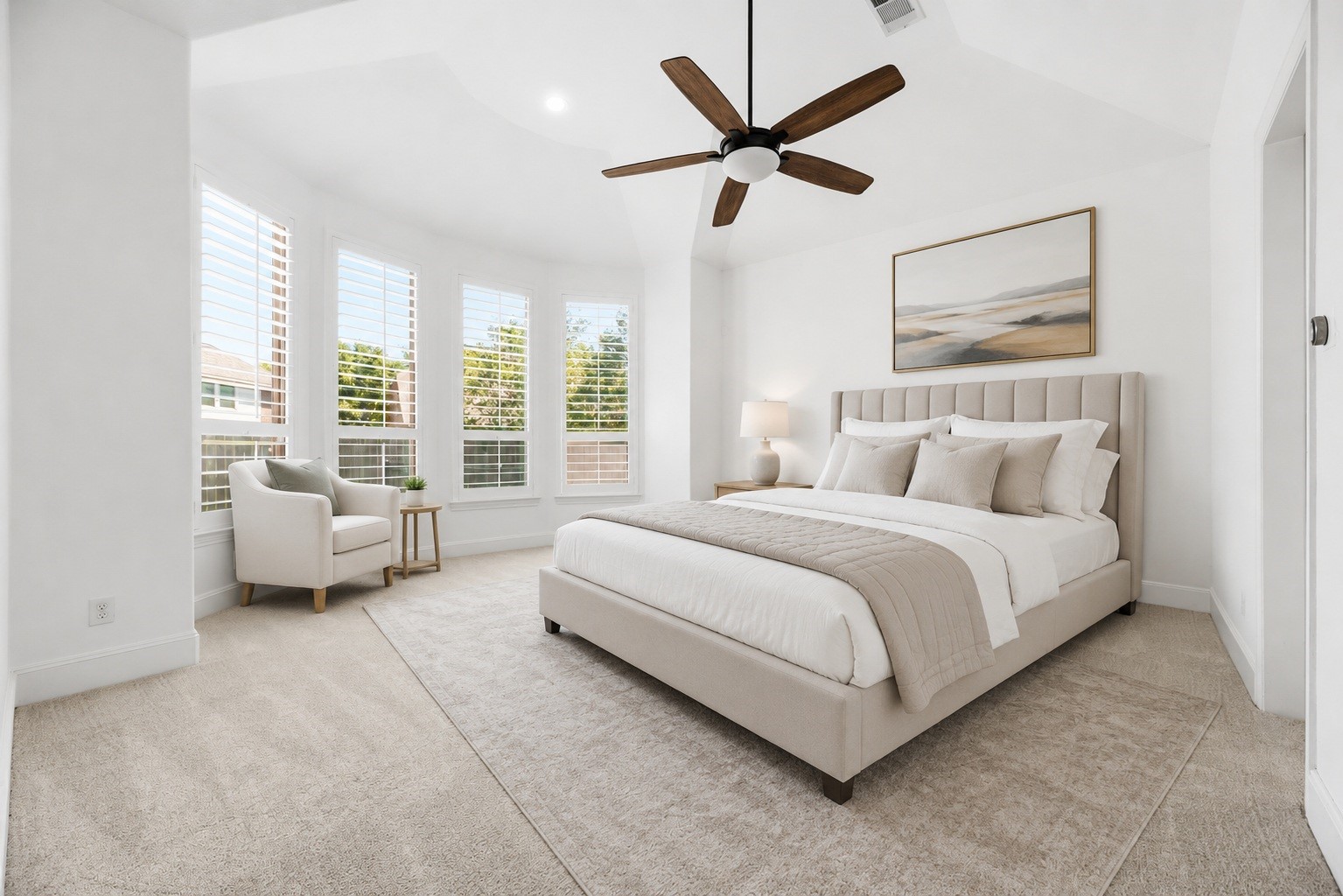 28226 South Firethorne Road Katy, TX 77494 - Photo 15 of 39 Located on the main level, the spacious primary suite offers a serene escape defined by a soaring tray ceiling, plush carpeting, and a private sitting area framed by large windows with custom shutters. Virtually staged.