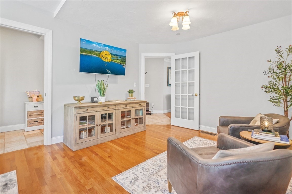 50 Rocky Brook Road North Andover, MA 01845 - Photo 16 of 42 a living room with furniture and a flat screen tv