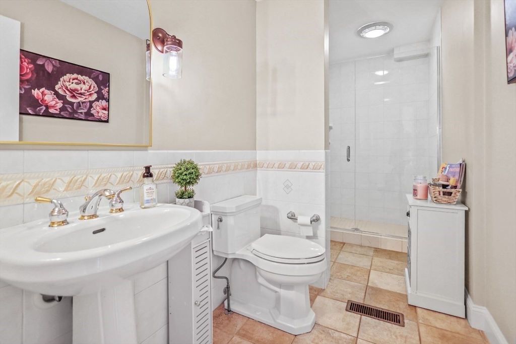 50 Rocky Brook Road North Andover, MA 01845 - Photo 17 of 42 a bathroom with a sink and a toilet