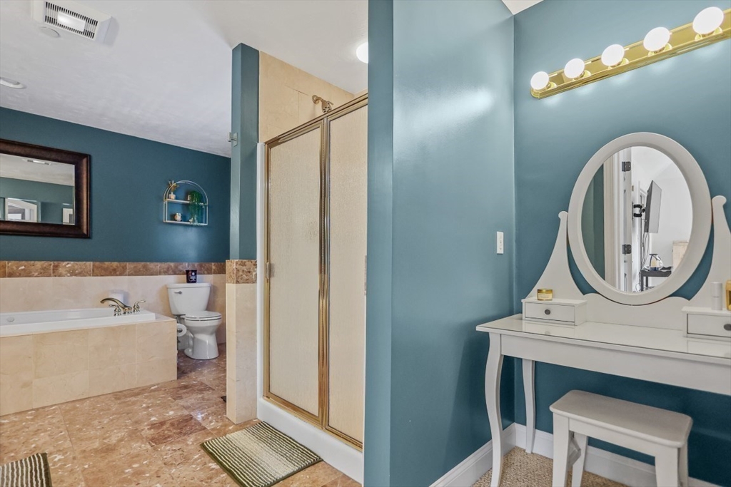 50 Rocky Brook Road North Andover, MA 01845 - Photo 22 of 42 a bathroom with a toilet a sink and a mirror
