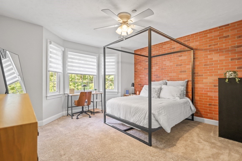 50 Rocky Brook Road North Andover, MA 01845 - Photo 24 of 42 a bedroom with a bed and a chandelier