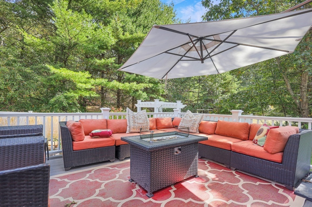 50 Rocky Brook Road North Andover, MA 01845 - Photo 31 of 42 a outdoor space with patio the couches and a umbrella
