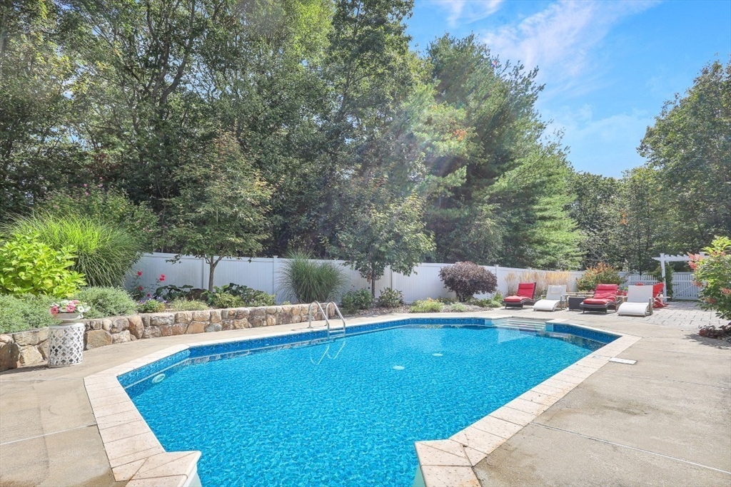 50 Rocky Brook Road North Andover, MA 01845 - Photo 33 of 42 a view of a swimming pool with a lounge chair