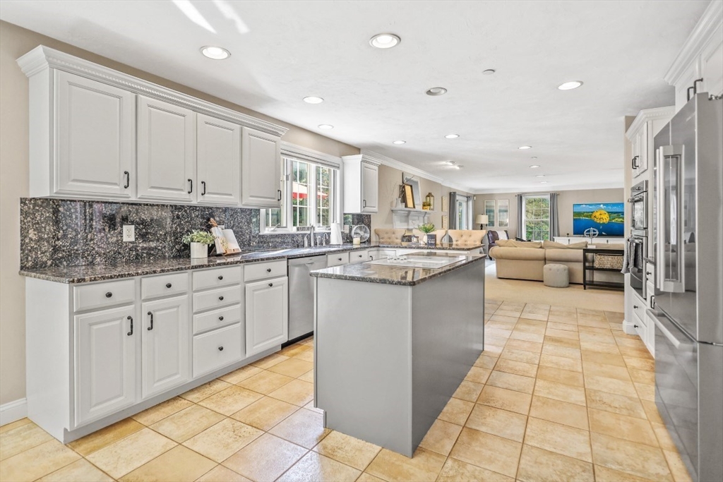 50 Rocky Brook Road North Andover, MA 01845 - Photo 4 of 42 a kitchen with stainless steel appliances kitchen island granite countertop a sink and cabinets