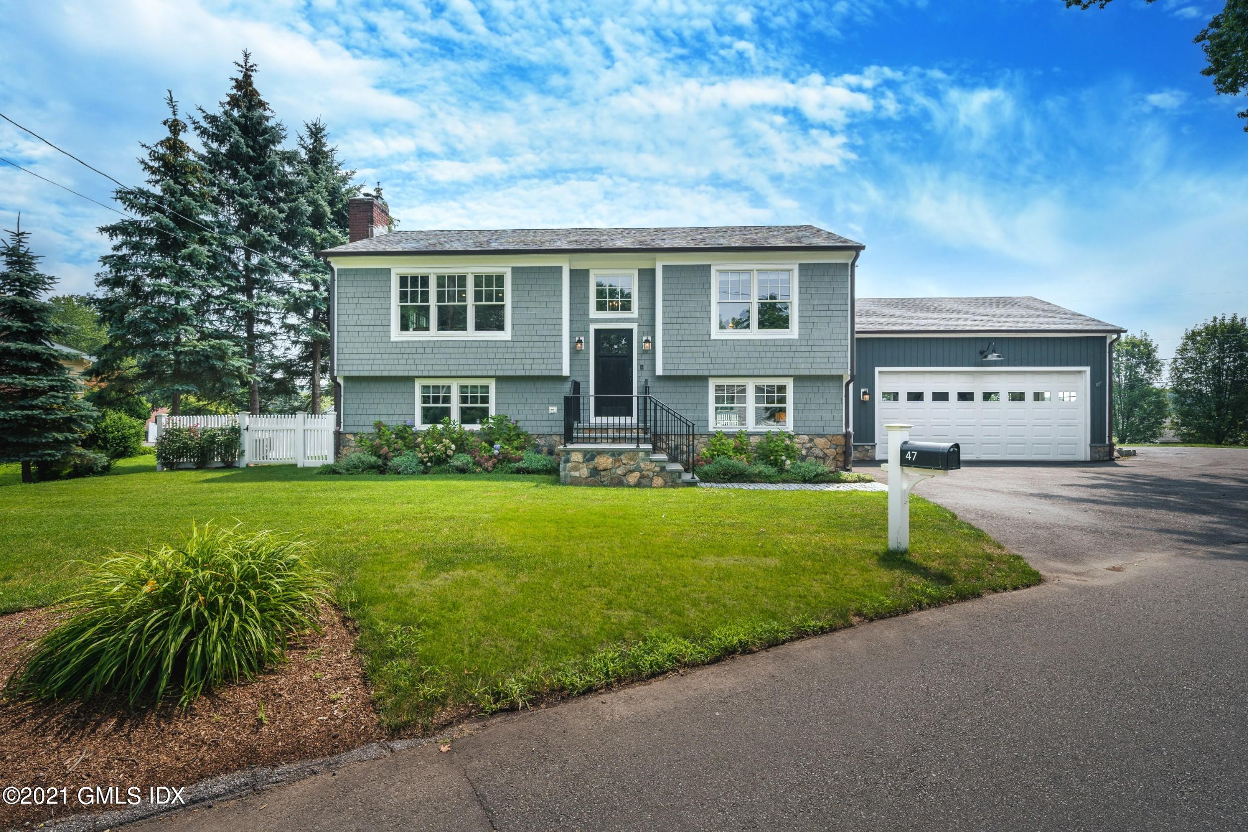 47 Cognewaugh Road Cos Cob, CT 06807 - Photo 1 of 44 a front view of house with yard and green space