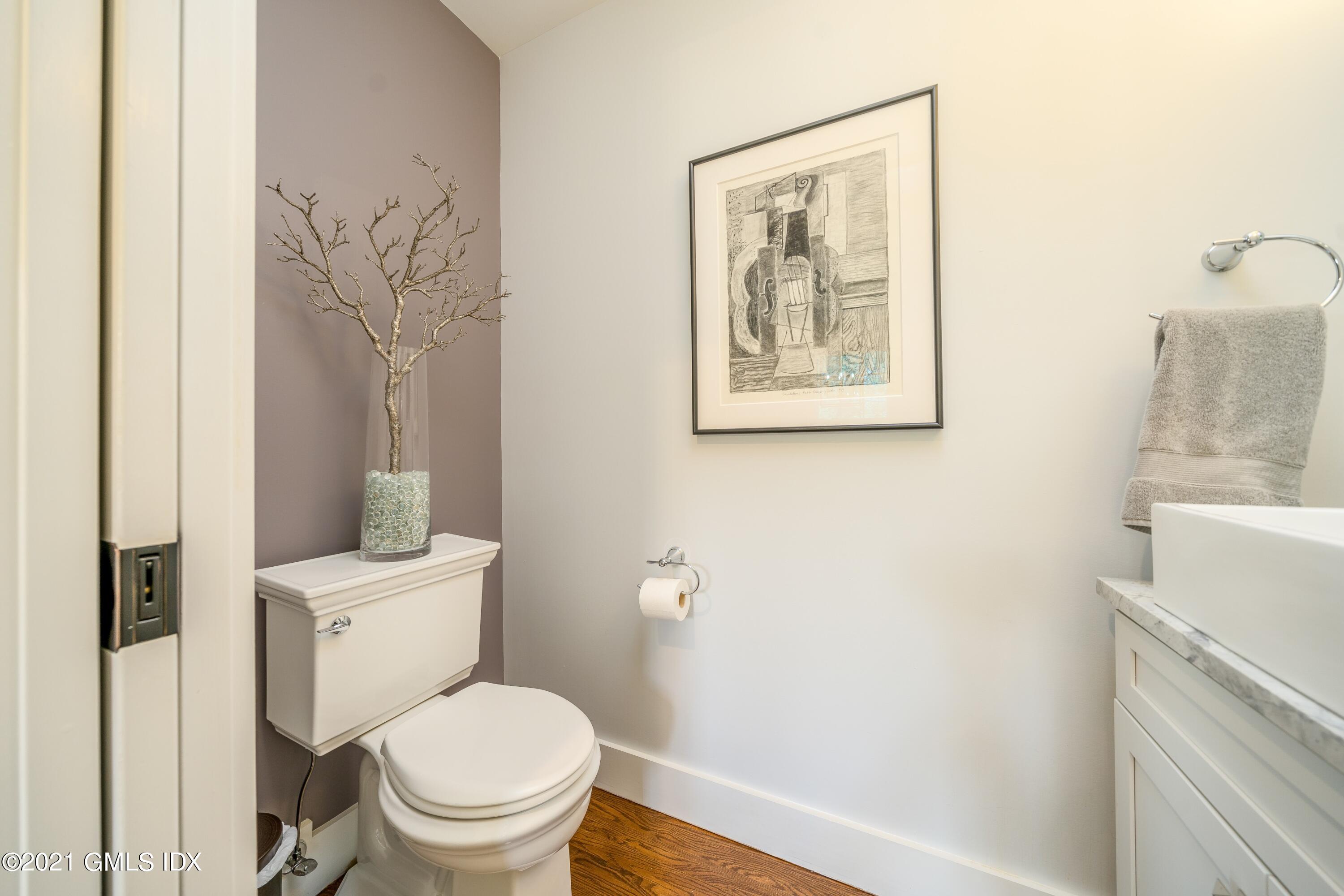 47 Cognewaugh Road Cos Cob, CT 06807 - Photo 15 of 44 a white toilet sitting next to a bathroom sink
