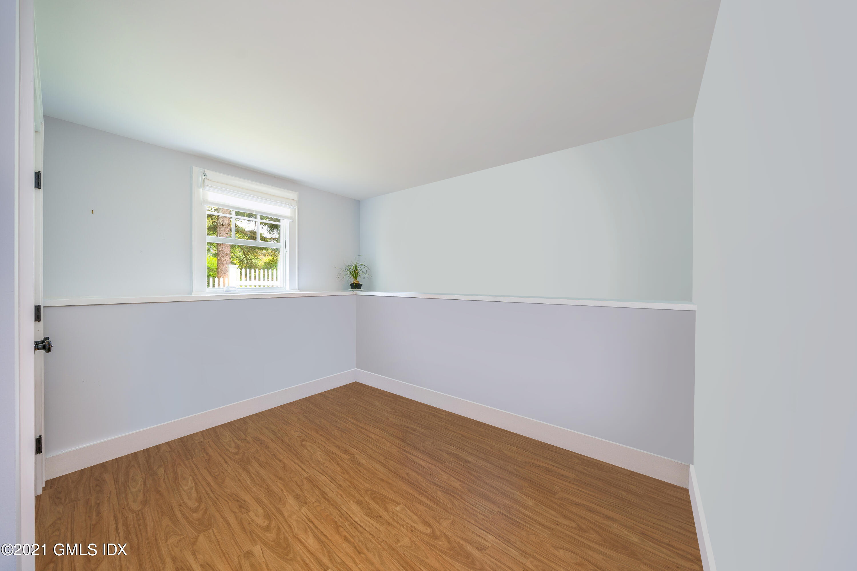 47 Cognewaugh Road Cos Cob, CT 06807 - Photo 33 of 44 an empty room with a window