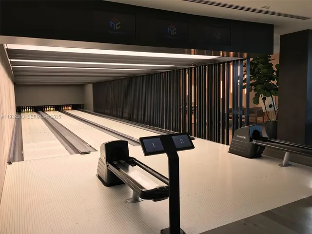 a living room with furniture and a painting on the wall