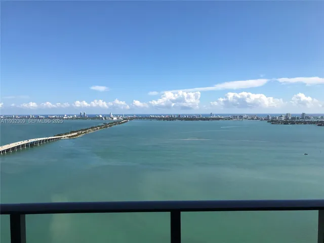 a view of a lake from a balcony