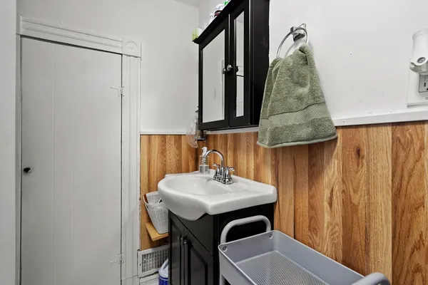 a bathroom with a sink and mirror