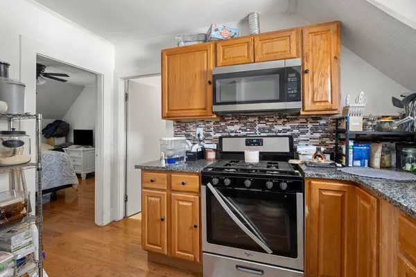 a kitchen with a stove and a microwave