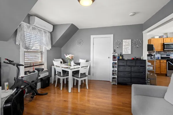 a view of a livingroom with furniture and a flat screen tv