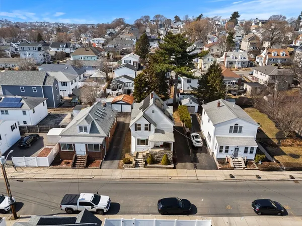 a view of multiple houses with a street