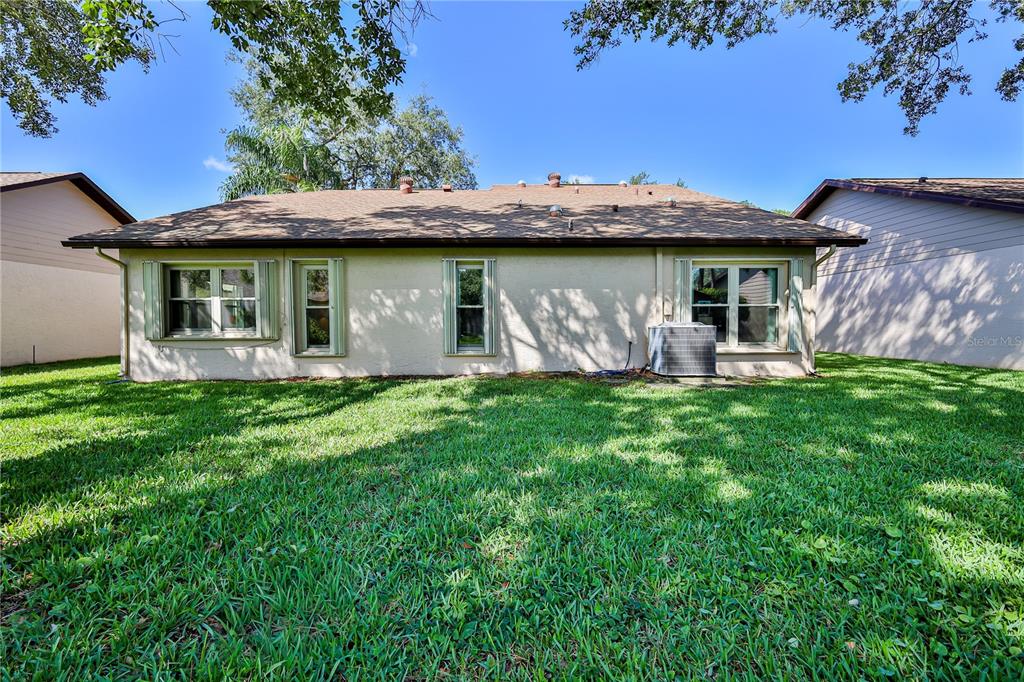 2662 Appleleaf Court Spring Hill, FL 34606 - Photo 32 of 47 a front view of a house with garden