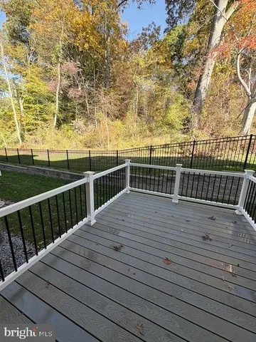 a view of balcony with wooden floor