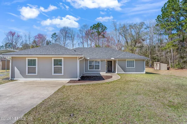 front view of a house with a yard