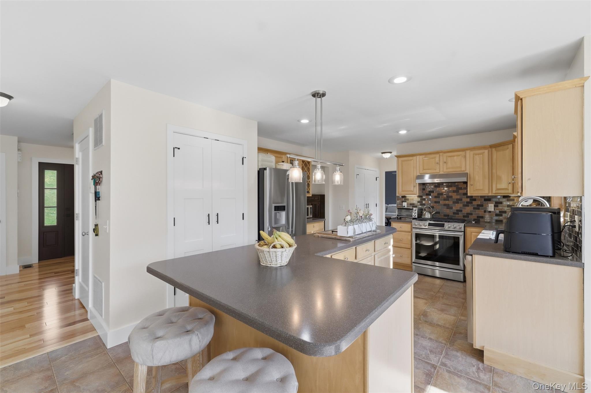 233 Devon Farms Road Stormville, NY 12582 - Photo 15 of 48 a kitchen with stainless steel appliances granite countertop a sink counter space and cabinets