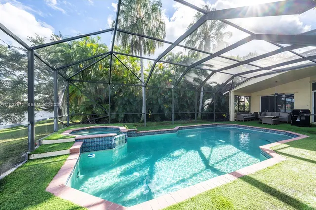a view of swimming pool with a backyard