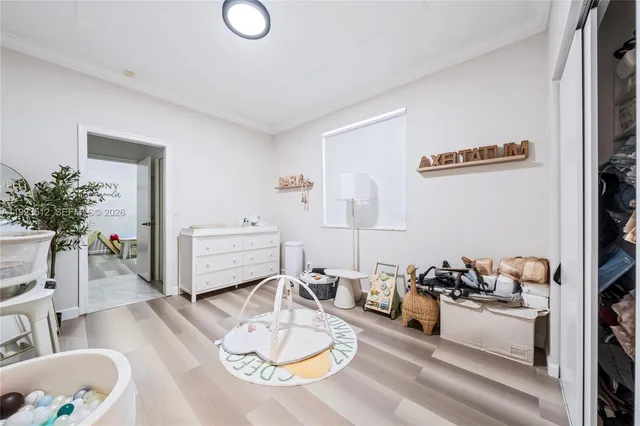 a living room with furniture and flowers