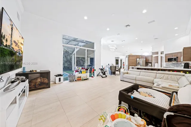 a room with furniture and a flat screen tv