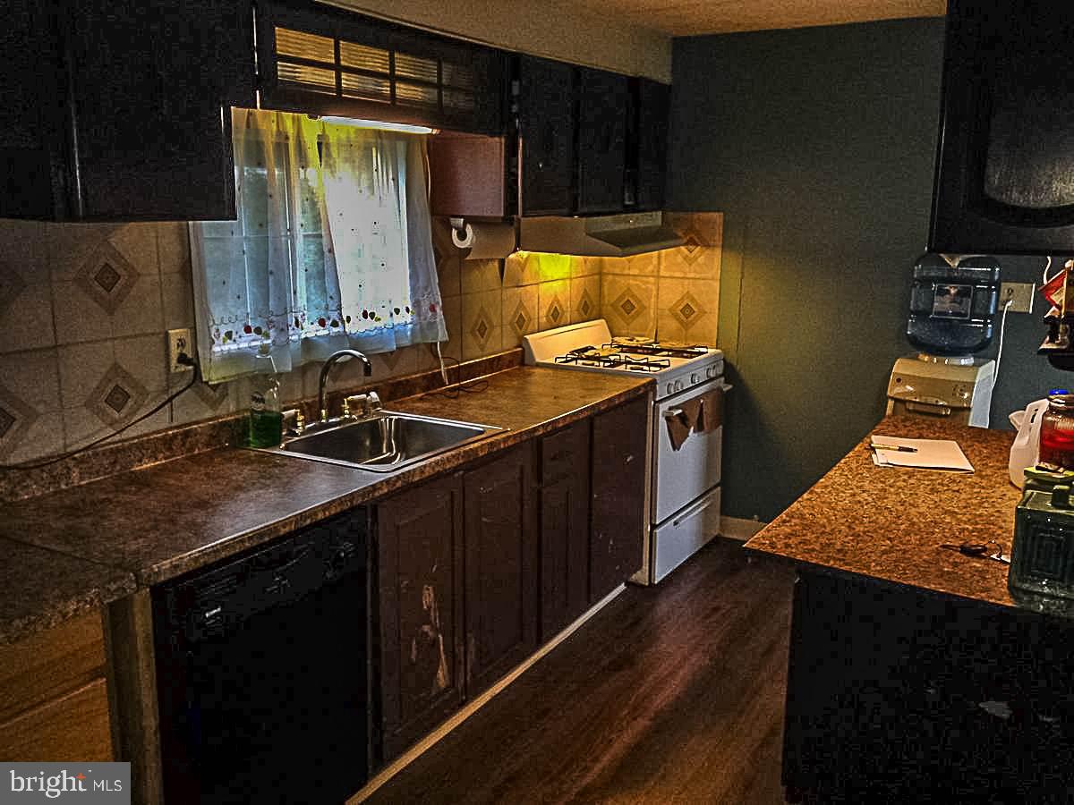 1347 Pine Grove Road Hanover, PA 17331 - Photo 7 of 18 a kitchen with a sink stove and refrigerator
