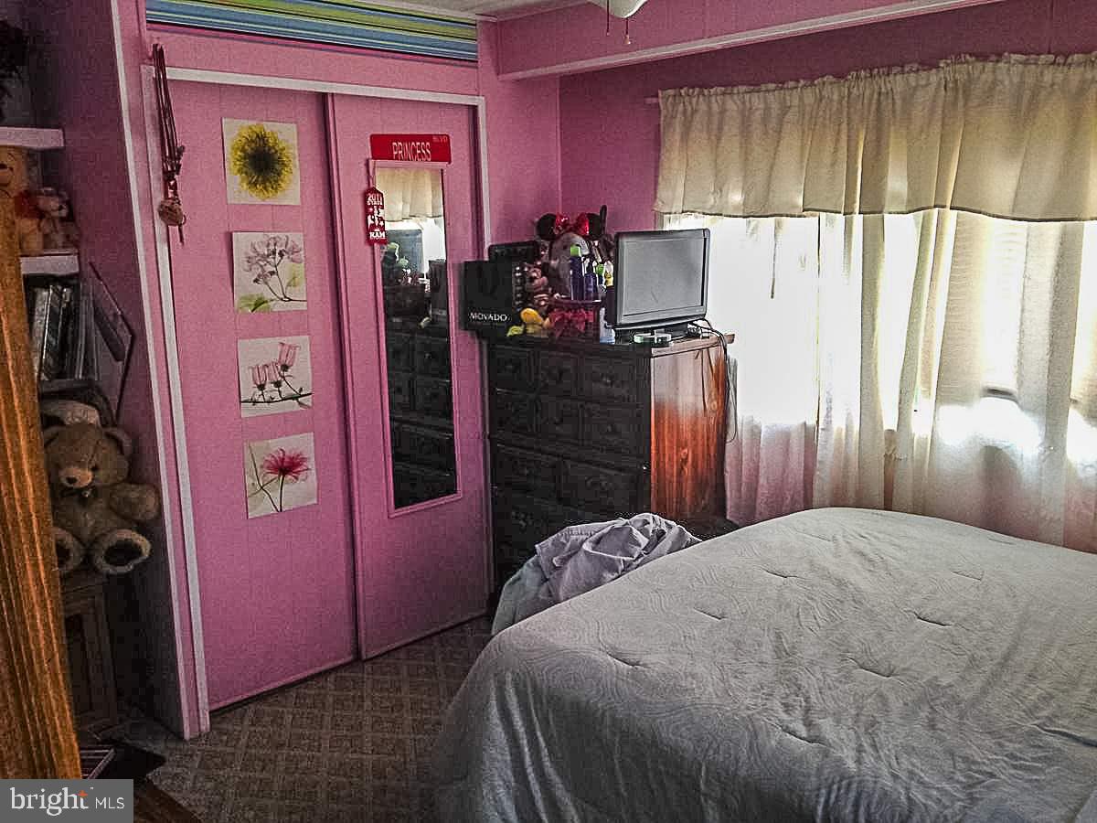 1347 Pine Grove Road Hanover, PA 17331 - Photo 10 of 18 a bedroom with a bed and a mirror