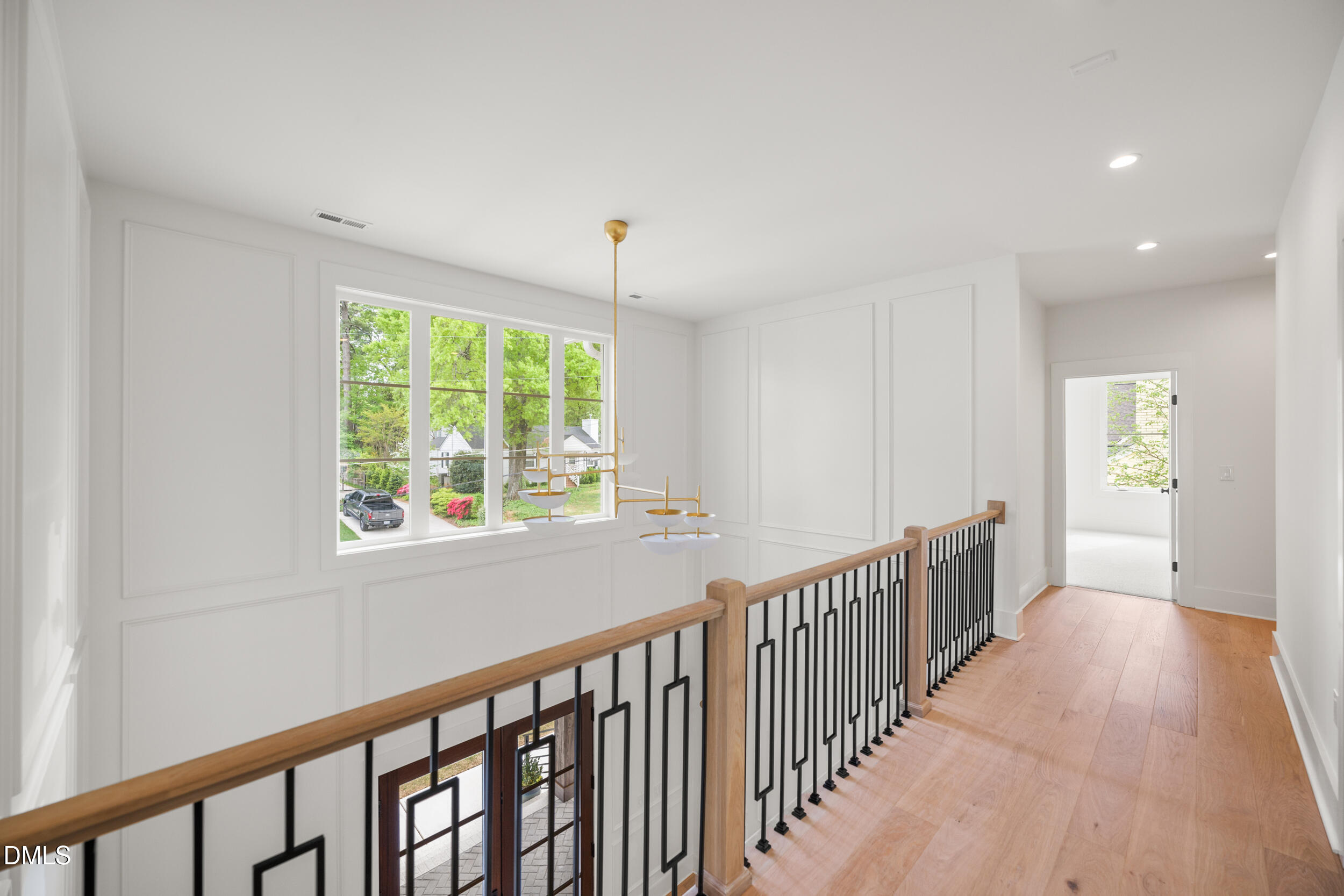2817 Claremont Road Raleigh, NC 27608 - Photo 49 of 73 a view of hallway with wooden floor and windows