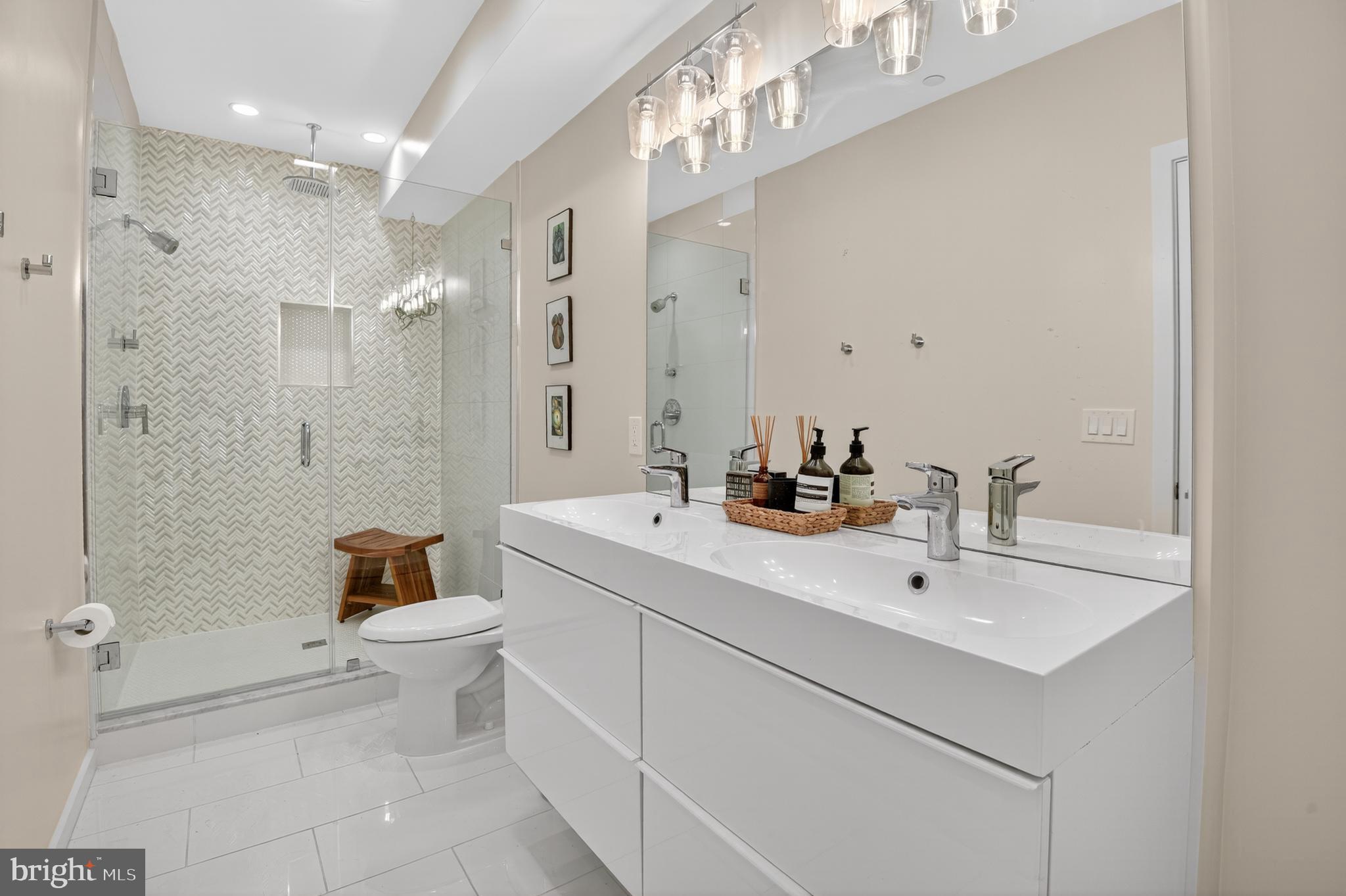 3911 Kansas Avenue Northwest, Unit 2 Washington, DC 20011 - Photo 20 of 46 a bathroom with a sink a toilet and shower
