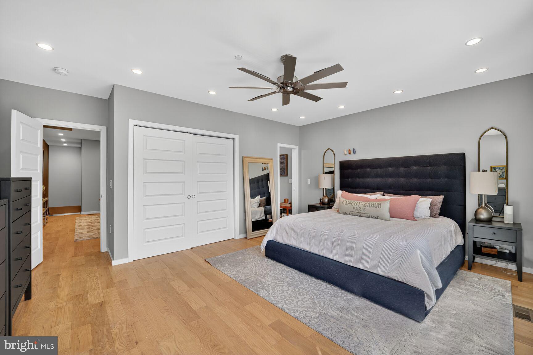 3911 Kansas Avenue Northwest, Unit 2 Washington, DC 20011 - Photo 31 of 46 a bedroom with a large bed and ceiling fan