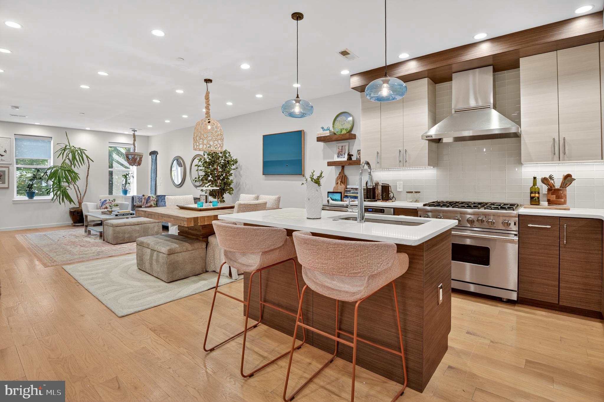 3911 Kansas Avenue Northwest, Unit 2 Washington, DC 20011 - Photo 5 of 46 a kitchen with stainless steel appliances kitchen island a large island in the center