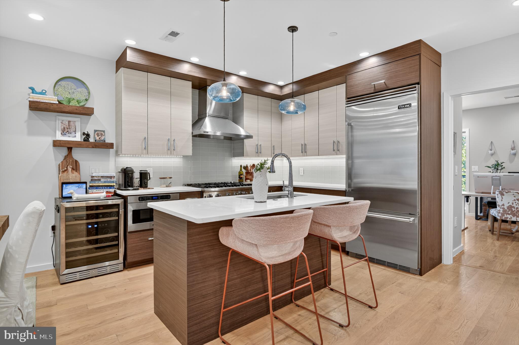 3911 Kansas Avenue Northwest, Unit 2 Washington, DC 20011 - Photo 6 of 46 a kitchen with kitchen island a counter space a sink and appliances