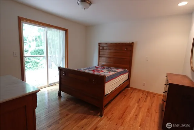 a white toilet sitting next to a shower curtain