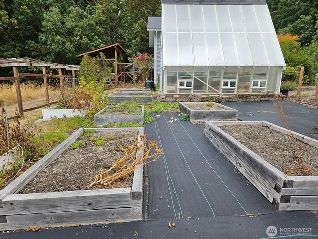 a view of a chair and tables back yard of the house