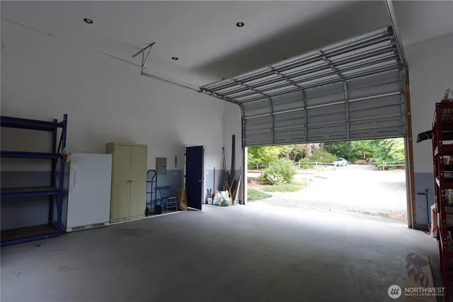 a view of large room with furniture and a large window